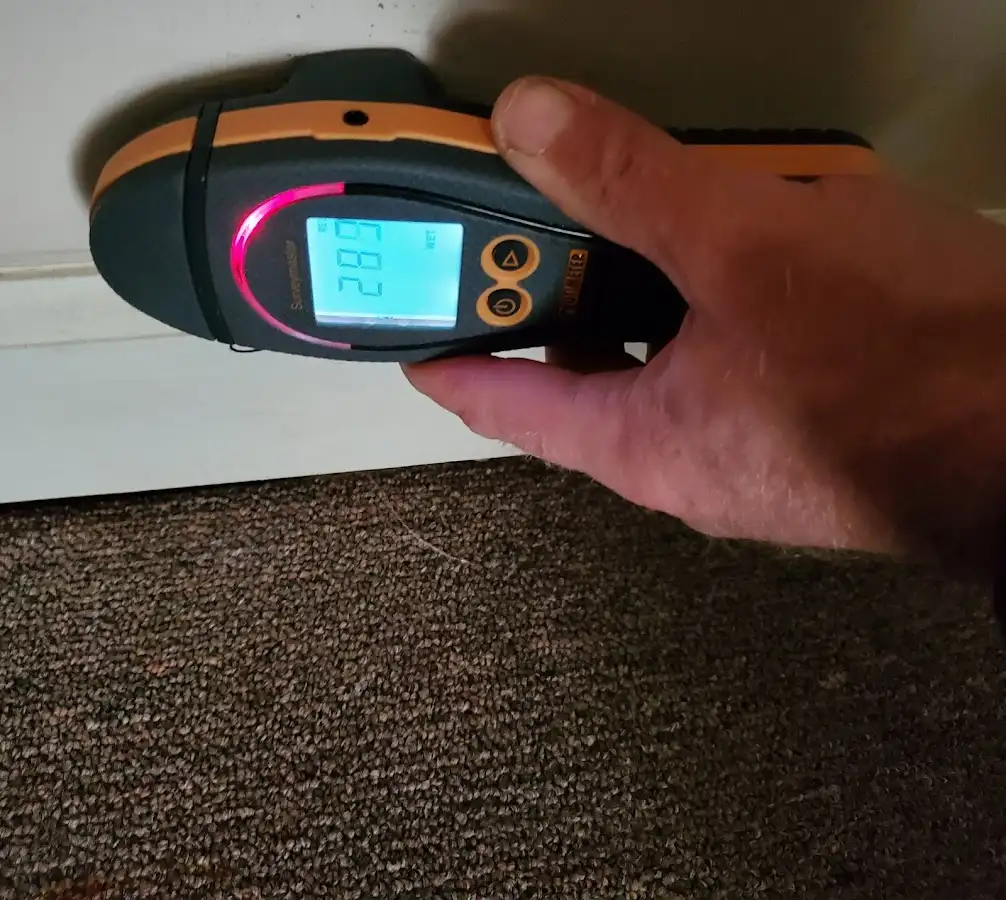 Moisture detection at baseboard during Burst Pipe Cleanup in Conway